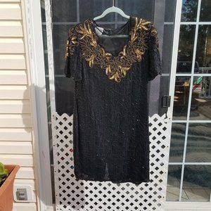 Stenay Black beaded dress with gold accents.